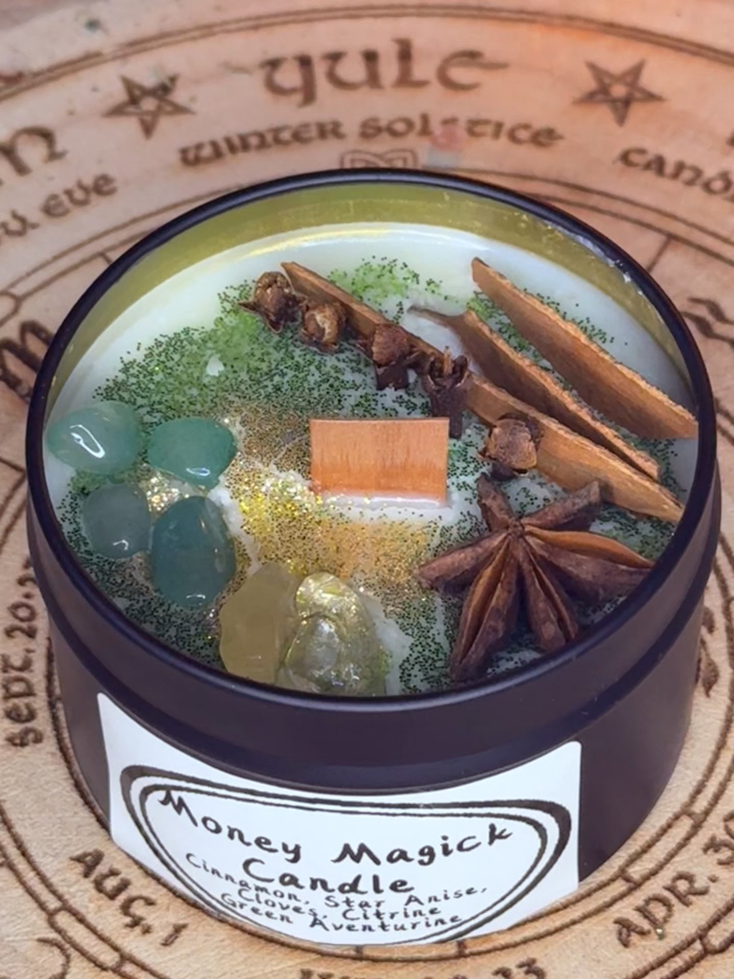 Money Magick Candles with genuine crystals.